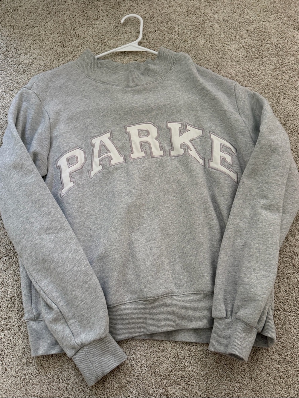 PARKE grey mockneck with white lettering